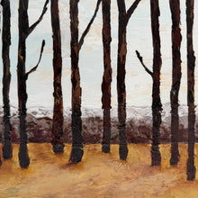 An impressionistic landscape painting of a grove of tall, dark, leafless trees standing in a golden-brown field under a pale sky with a band of snowy mountains in the background.